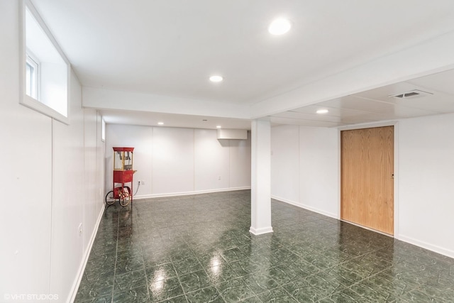 below grade area featuring visible vents, recessed lighting, and baseboards