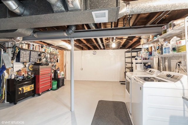 unfinished below grade area with visible vents and washing machine and dryer