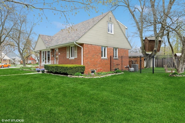 view of property exterior featuring a lawn, fence, central AC unit, and brick siding