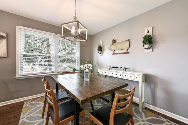 317 Roberts Rd, Inverness, IL 60010 - dining space with baseboards, wood finished floors, and a chandelier