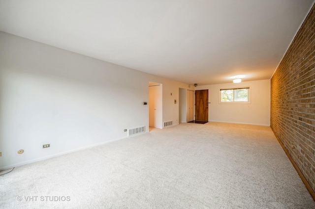 4726 Russet Ln Unit R107, Skokie, IL 60076 - empty room featuring brick wall and light carpet