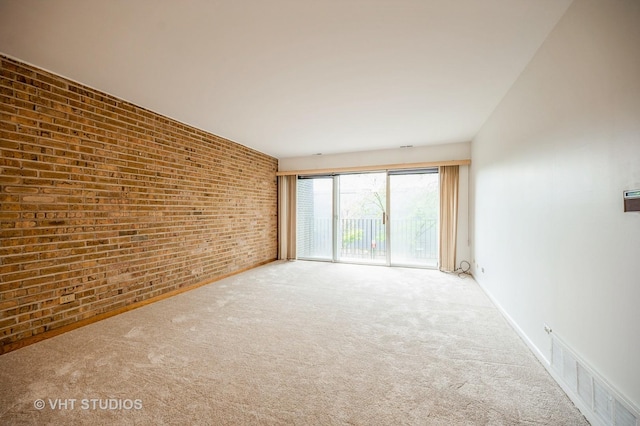 4726 Russet Ln Unit R107, Skokie, IL 60076 - carpeted spare room with brick wall