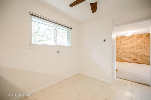 4726 Russet Ln Unit R107, Skokie, IL 60076 - empty room with brick wall, light flooring, ceiling fan, light carpet, and baseboards