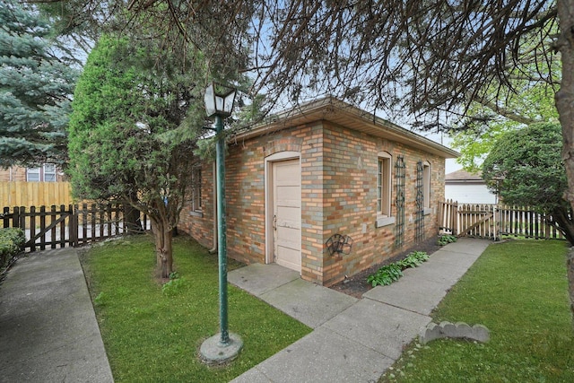 view of outbuilding featuring fence