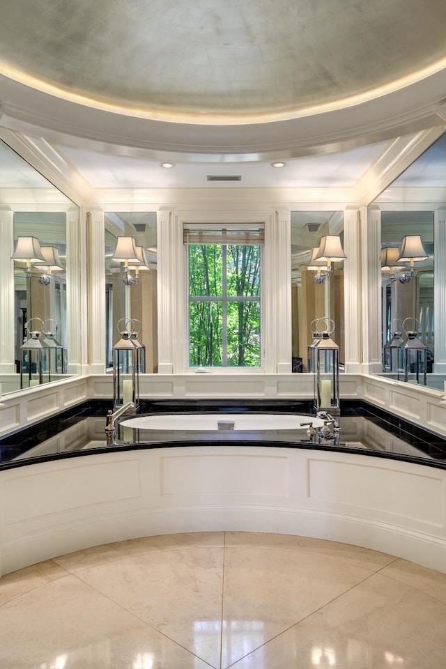 401 W Dickens Ave, Chicago, IL 60614 - interior space featuring a tray ceiling, dark countertops, tile patterned flooring, and white cabinetry