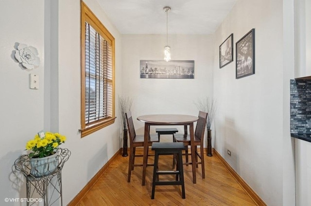 5840 N Saint Louis Ave Unit 2N, Chicago, IL 60659 - dining room featuring wood finished floors and baseboards
