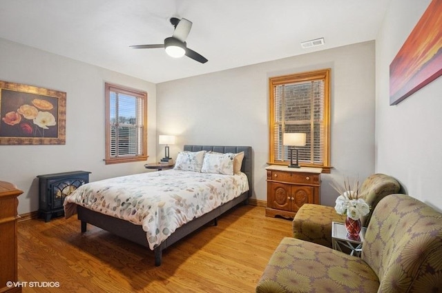 5840 N Saint Louis Ave Unit 2N, Chicago, IL 60659 - bedroom featuring light wood-type flooring, visible vents, a ceiling fan, and baseboards