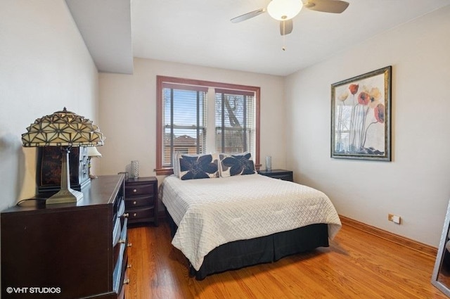 5840 N Saint Louis Ave Unit 2N, Chicago, IL 60659 - bedroom with baseboards, a ceiling fan, and wood finished floors