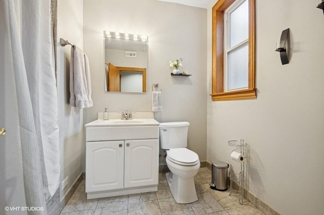 5840 N Saint Louis Ave Unit 2N, Chicago, IL 60659 - bathroom featuring vanity, marble finish floor, baseboards, toilet, and visible vents