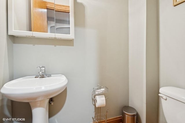 5840 N Saint Louis Ave Unit 2N, Chicago, IL 60659 - bathroom featuring a sink and toilet