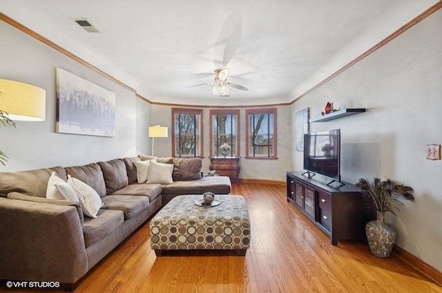 5840 N Saint Louis Ave Unit 2N, Chicago, IL 60659 - living area featuring baseboards, visible vents, a ceiling fan, wood finished floors, and ornamental molding