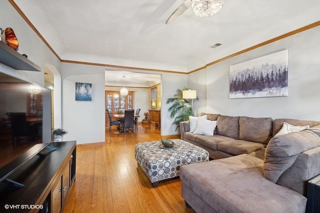 5840 N Saint Louis Ave Unit 2N, Chicago, IL 60659 - living area with crown molding, light wood-style floors, ceiling fan, baseboards, and visible vents