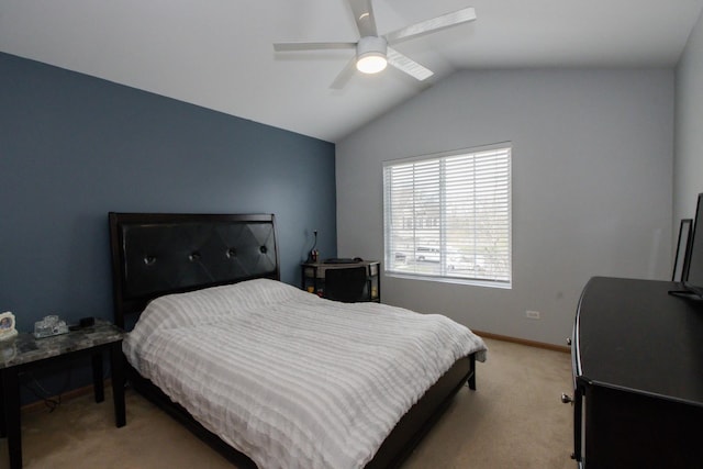 bedroom with baseboards, ceiling fan, light carpet, and lofted ceiling