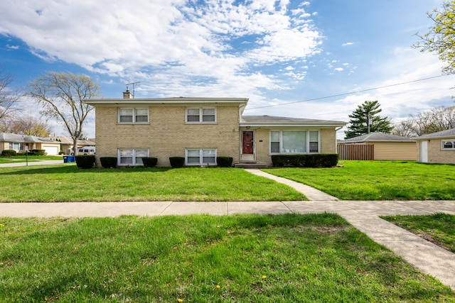 1291 Fargo Ave, Des Plaines, IL 60018 - tri-level home featuring a front lawn, brick siding, and a chimney