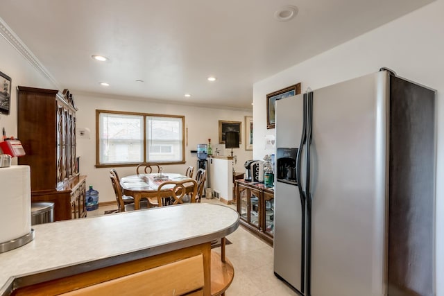 1291 Fargo Ave, Des Plaines, IL 60018 - kitchen with recessed lighting, ornamental molding, stainless steel refrigerator with ice dispenser, light countertops, and light tile patterned floors