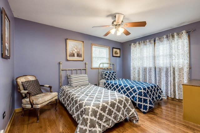 1291 Fargo Ave, Des Plaines, IL 60018 - bedroom with baseboards, wood finished floors, and ceiling fan