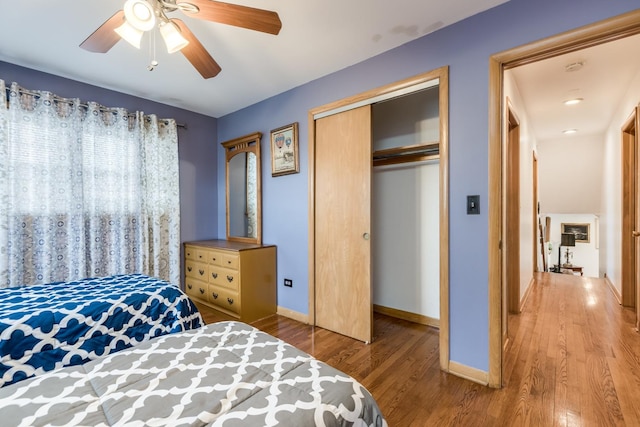 1291 Fargo Ave, Des Plaines, IL 60018 - bedroom with wood finished floors, a closet, baseboards, and ceiling fan