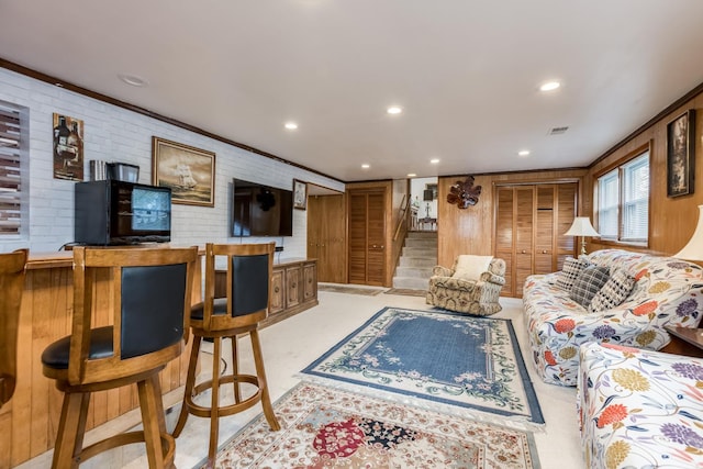 1291 Fargo Ave, Des Plaines, IL 60018 - living room featuring brick wall, visible vents, recessed lighting, and stairway