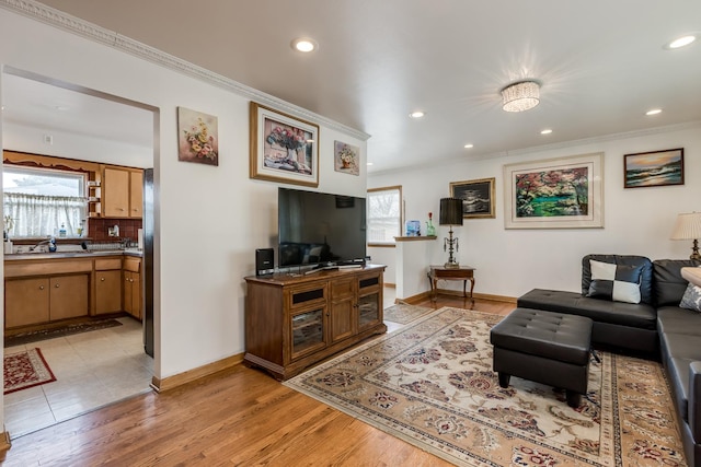 1291 Fargo Ave, Des Plaines, IL 60018 - living area with a healthy amount of sunlight, baseboards, and ornamental molding
