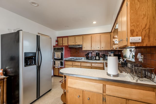 1291 Fargo Ave, Des Plaines, IL 60018 - kitchen featuring a peninsula, stainless steel fridge, a warming drawer, under cabinet range hood, and black oven