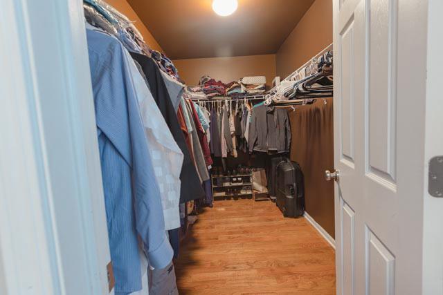 spacious closet featuring wood finished floors