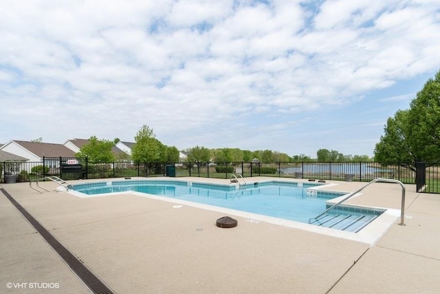 community pool featuring a patio area and fence