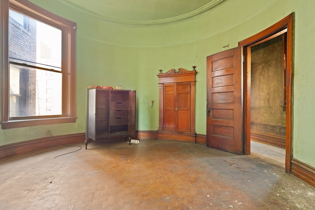 3936 S King Dr, Chicago, IL 60653 - unfurnished living room featuring baseboards and ornamental molding