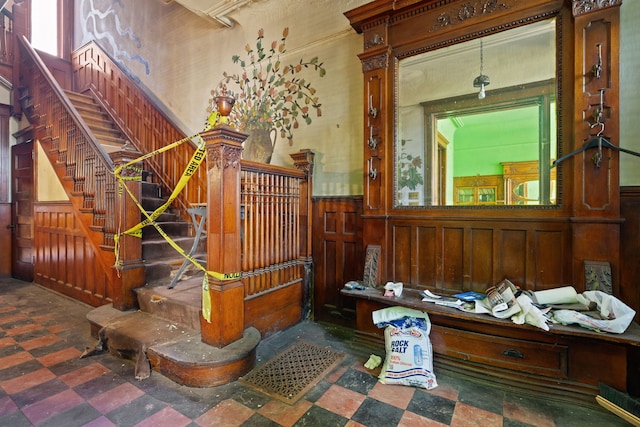 3936 S King Dr, Chicago, IL 60653 - living area featuring wainscoting, tile patterned floors, stairs, and wooden walls