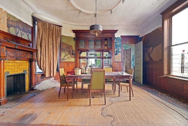 3936 S King Dr, Chicago, IL 60653 - dining space with track lighting, a fireplace with raised hearth, hardwood / wood-style flooring, and ornamental molding