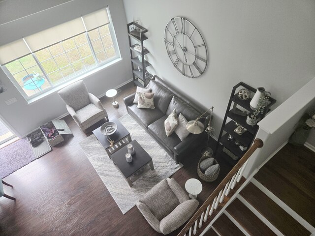 living room featuring wood finished floors and baseboards