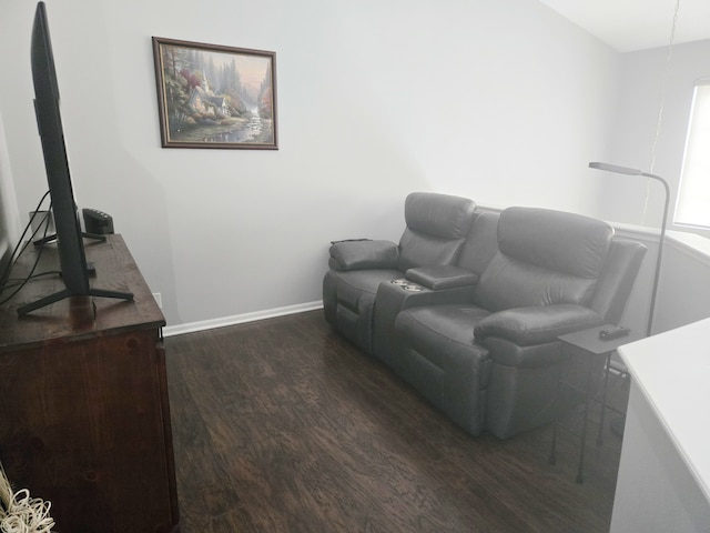 living area featuring wood finished floors and baseboards