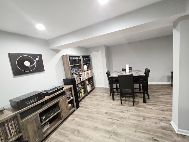 dining room with light wood finished floors, recessed lighting, and baseboards