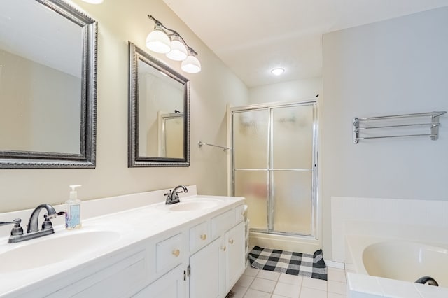 full bathroom with a sink, tile patterned flooring, and a shower stall