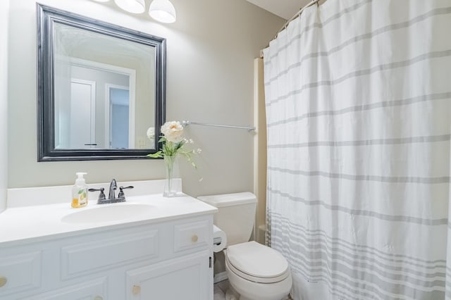 bathroom with vanity, toilet, and a shower with shower curtain