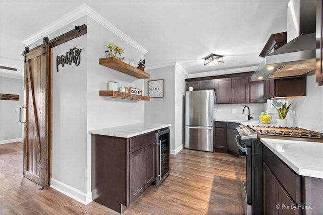 219 E Streamwood Blvd, Streamwood, IL 60107 - kitchen with open shelves, beverage cooler, a barn door, wall chimney exhaust hood, and stainless steel appliances
