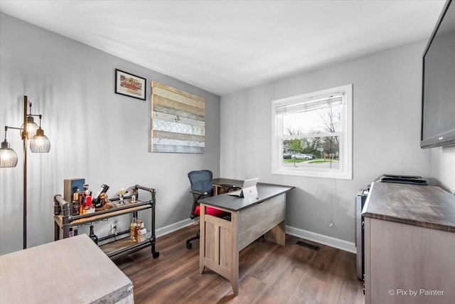 219 E Streamwood Blvd, Streamwood, IL 60107 - office featuring baseboards, visible vents, and dark wood-style floors