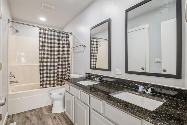 43 S Treehouse Ln, Round Lake, IL 60073 - bathroom featuring toilet, wood finished floors, a sink, and visible vents