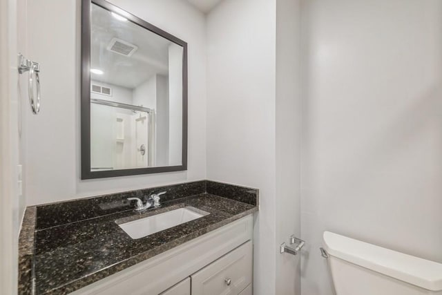 43 S Treehouse Ln, Round Lake, IL 60073 - bathroom featuring walk in shower, visible vents, toilet, and vanity