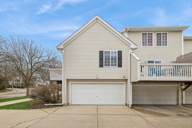 43 S Treehouse Ln, Round Lake, IL 60073 - view of front of home featuring an attached garage, driveway, and a balcony