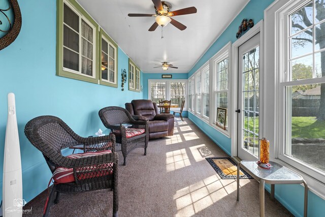 sunroom / solarium featuring french doors and carpet floors