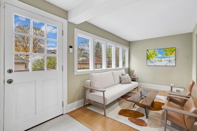 sunroom / solarium featuring a healthy amount of sunlight