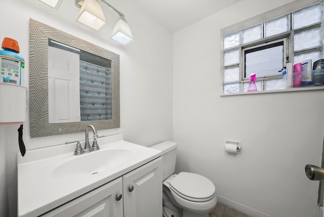 bathroom with toilet and vanity