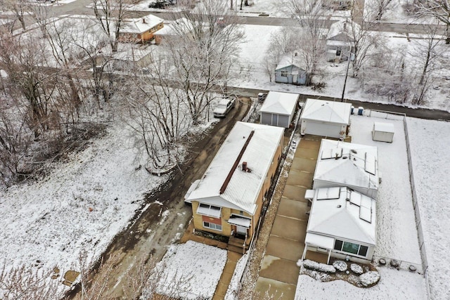snowy aerial view featuring a residential view