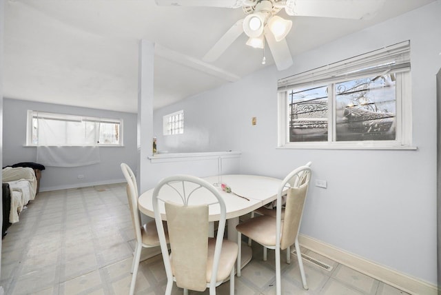 dining space with baseboards, a ceiling fan, visible vents, and tile patterned floors