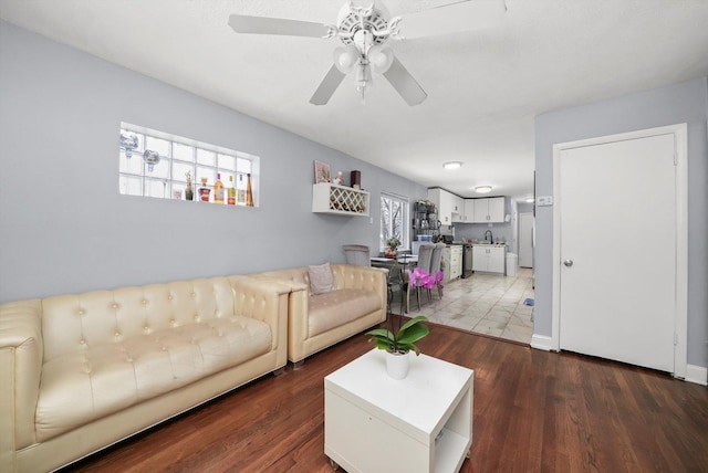living area featuring wood finished floors and a ceiling fan