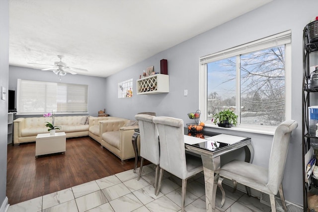 dining space with ceiling fan