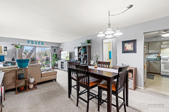 3350 N Carriageway Dr Unit 217, Arlington Heights, IL 60004 - dining room with a notable chandelier and light carpet