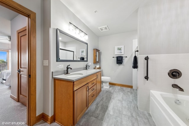 14 S Prospect St Unit 508, Roselle, IL 60172 - full bath with double vanity, a bath, connected bathroom, and a ceiling fan