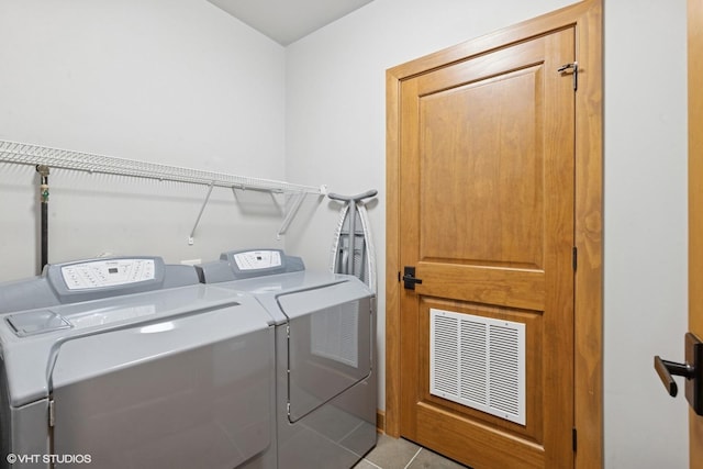 14 S Prospect St Unit 508, Roselle, IL 60172 - laundry room featuring washing machine and dryer and tile patterned flooring