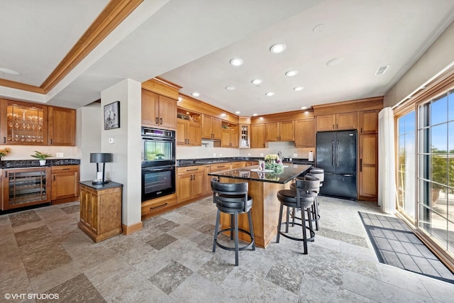 14 S Prospect St Unit 508, Roselle, IL 60172 - kitchen featuring black appliances, wine cooler, a breakfast bar, a kitchen island, and glass insert cabinets